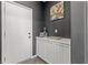 Entryway features a door, built-in storage, and contemporary decor at 10776 Maltese Falcon Ave, Las Vegas, NV 89129