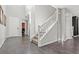 Bright foyer featuring tile floors, staircase and a view into another room at 10776 Maltese Falcon Ave, Las Vegas, NV 89129