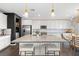 Gourmet kitchen with island, stainless steel appliances, and a breakfast nook at 10776 Maltese Falcon Ave, Las Vegas, NV 89129