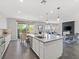 Spacious kitchen with gray countertops, stainless steel appliances, and an open layout to the living area at 10776 Maltese Falcon Ave, Las Vegas, NV 89129