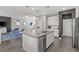 Well-lit kitchen with a large island, stainless steel appliances, and modern finishes at 10776 Maltese Falcon Ave, Las Vegas, NV 89129