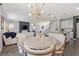 Open-concept kitchen and dining area with modern lighting and stainless steel appliances at 10776 Maltese Falcon Ave, Las Vegas, NV 89129