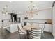Stylish kitchen features an island with seating, modern lighting, and stainless steel appliances at 10776 Maltese Falcon Ave, Las Vegas, NV 89129