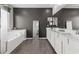 Luxury main bath with soaking tub, dual sink vanity, and a contemporary design at 10776 Maltese Falcon Ave, Las Vegas, NV 89129