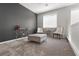 Upstairs sitting area featuring neutral carpet and modern furniture at 10776 Maltese Falcon Ave, Las Vegas, NV 89129