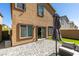 Enclosed backyard featuring stone pavers, a patch of lawn, and access to the home at 10939 Cheshire Woods Ave, Las Vegas, NV 89166