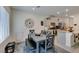 Inviting dining area adjacent to the kitchen, perfect for Gathering meals and entertaining at 10939 Cheshire Woods Ave, Las Vegas, NV 89166