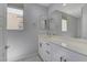Clean, secondary bathroom with a white vanity, solid surface countertop, and walk-in shower at 11377 Gravitation Dr, Las Vegas, NV 89135