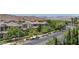 Street view showing the front of the community and mountains in the distance at 11377 Gravitation Dr, Las Vegas, NV 89135