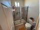 Modern bathroom features glass shower, tiled walls and updated fixtures at 1146 Olivia Pkwy, Henderson, NV 89011