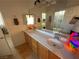 Bathroom featuring vanity with dual sinks and a tub/shower combo in the background at 1146 Olivia Pkwy, Henderson, NV 89011