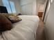 Bedroom with a large, comfortable bed, sliding closet doors, and wood-look floors at 1146 Olivia Pkwy, Henderson, NV 89011