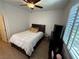Cozy bedroom with ceiling fan, window shutters, and ample natural light at 1146 Olivia Pkwy, Henderson, NV 89011