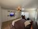 This bedroom features custom built-in cabinets, a ceiling fan, and warm lighting for a cozy feel at 1146 Olivia Pkwy, Henderson, NV 89011