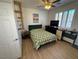 Bedroom featuring wood-look floors, plantation shutters and a ceiling fan at 1146 Olivia Pkwy, Henderson, NV 89011