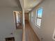 Hallway with natural light and wood-look floors, bright and airy at 1146 Olivia Pkwy, Henderson, NV 89011