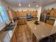 Spacious kitchen boasts a center island, granite countertops, and stainless appliances at 1146 Olivia Pkwy, Henderson, NV 89011