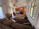 Bright living room with fireplace, large windows and comfortable seating at 1146 Olivia Pkwy, Henderson, NV 89011