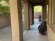 Covered patio with decorative columns and outdoor seating area at 1146 Olivia Pkwy, Henderson, NV 89011