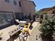 Inviting patio with comfortable seating and an outdoor dining area, perfect for relaxing and entertaining at 1146 Olivia Pkwy, Henderson, NV 89011
