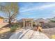 Outdoor patio with a swing and desert landscaping, perfect for relaxing in a private backyard at 1239 N Hollywood Blvd, Las Vegas, NV 89110