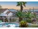 Backyard view showcasing lush desert landscaping, pool and spa area, and city views at 1239 N Hollywood Blvd, Las Vegas, NV 89110