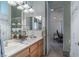 Bathroom features double sinks, open shelving and a view to the bedroom with a closet at 1239 N Hollywood Blvd, Las Vegas, NV 89110