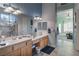 Spacious bathroom showcasing a double sink vanity, modern lighting, and a luxurious glass-enclosed shower at 1239 N Hollywood Blvd, Las Vegas, NV 89110