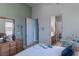 Cozy bedroom features a dresser, and a sewing machine, with ensuite bathroom and closet at 1239 N Hollywood Blvd, Las Vegas, NV 89110