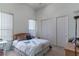 Serene bedroom with a comfortable bed, ample closet space, and soft natural lighting at 1239 N Hollywood Blvd, Las Vegas, NV 89110