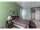 Cozy bedroom featuring stylish furniture and a soothing color palette with decorative artwork adorning the walls at 1239 N Hollywood Blvd, Las Vegas, NV 89110