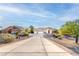 Desirable property featuring a spacious driveway and desert-style landscaping at 1239 N Hollywood Blvd, Las Vegas, NV 89110