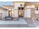 Inviting front entrance with stone accents and a cozy bench for seating at 1239 N Hollywood Blvd, Las Vegas, NV 89110