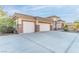 Spacious three-car garage with stone accents on a well-maintained driveway at 1239 N Hollywood Blvd, Las Vegas, NV 89110