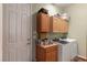 Well-equipped laundry room with washer, dryer, cabinets, and counter space for convenience at 1239 N Hollywood Blvd, Las Vegas, NV 89110