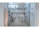 Beautiful walk-in shower featuring dual shower heads, bench seating, and elegant tile work enclosed with clear glass at 1239 N Hollywood Blvd, Las Vegas, NV 89110