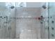 Luxurious walk-in shower with dual shower heads, bench seating and stylish tile accents for a spa-like experience at 1239 N Hollywood Blvd, Las Vegas, NV 89110