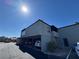 Two-story condo featuring covered parking and neutral stucco exterior under bright blue sky at 1460 Hialeah Dr # D, Las Vegas, NV 89119