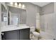 Bathroom boasts neutral walls, vanity, mirror, tub, and shower with neutral tiles at 15 Santo Mio Ct, Henderson, NV 89011