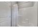 Clean, white shower with a shower curtain and a door located next to it at 15 Santo Mio Ct, Henderson, NV 89011