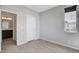 Bright bedroom features neutral walls, carpet, a window and an ensuite bathroom entrance at 15 Santo Mio Ct, Henderson, NV 89011