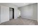 Bright bedroom features neutral walls, carpet, a closet with sliding doors, and ensuite at 15 Santo Mio Ct, Henderson, NV 89011