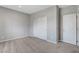 Bedroom with a double sliding closet adjacent to a single door at 15 Santo Mio Ct, Henderson, NV 89011