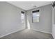 Bright bedroom features neutral carpet, light-colored walls and dual windows at 15 Santo Mio Ct, Henderson, NV 89011