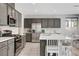 Bright kitchen featuring stainless steel appliances and breakfast bar at 15 Santo Mio Ct, Henderson, NV 89011