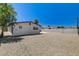 A spacious backyard featuring rock cover and clear skies at 1641 K St, Las Vegas, NV 89106