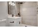 Modern bathroom with a sleek vanity, stylish mirror, and glass-enclosed shower at 1641 K St, Las Vegas, NV 89106