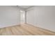 Bright bedroom featuring a closet with sliding doors and light wood-look floors at 1641 K St, Las Vegas, NV 89106