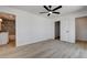A bedroom featuring neutral walls, a ceiling fan, and light wood-look floors at 1641 K St, Las Vegas, NV 89106