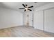 Clean bedroom with closet space, neutral walls, and modern ceiling fan at 1641 K St, Las Vegas, NV 89106